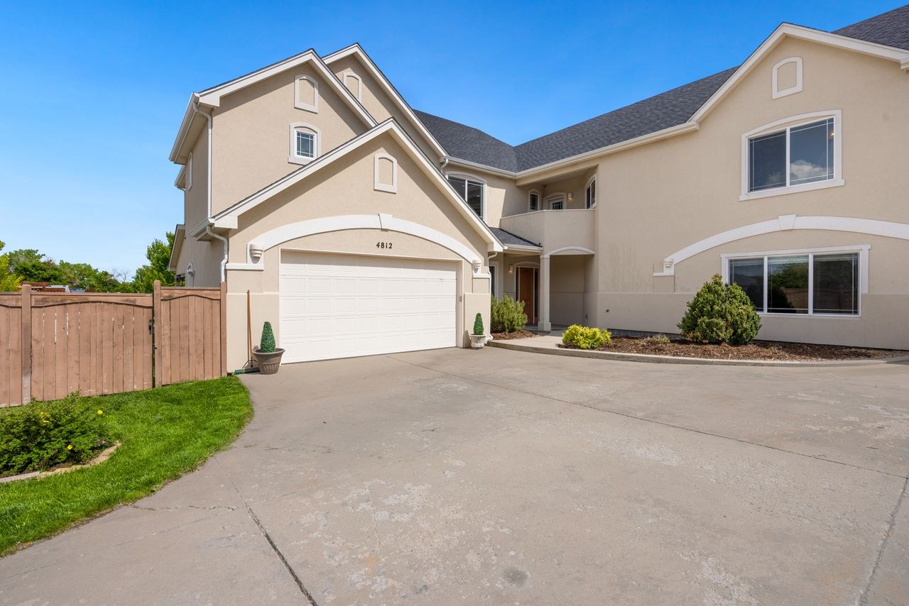Before — Soft sage two story house exterior paint